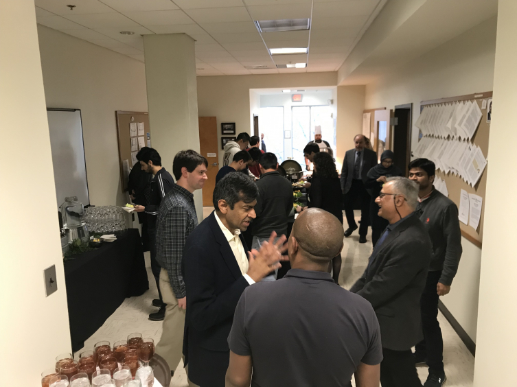 Dr. Chhabra with faculty and students enjoying the post-lecture reception.